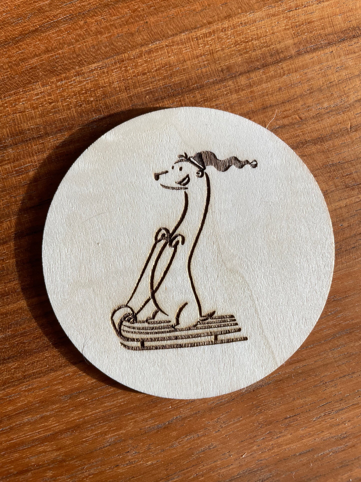 Happy sledding dog coaster